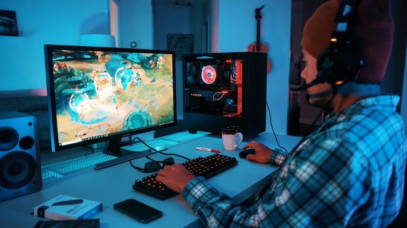 a person wearing headphones and using a computer